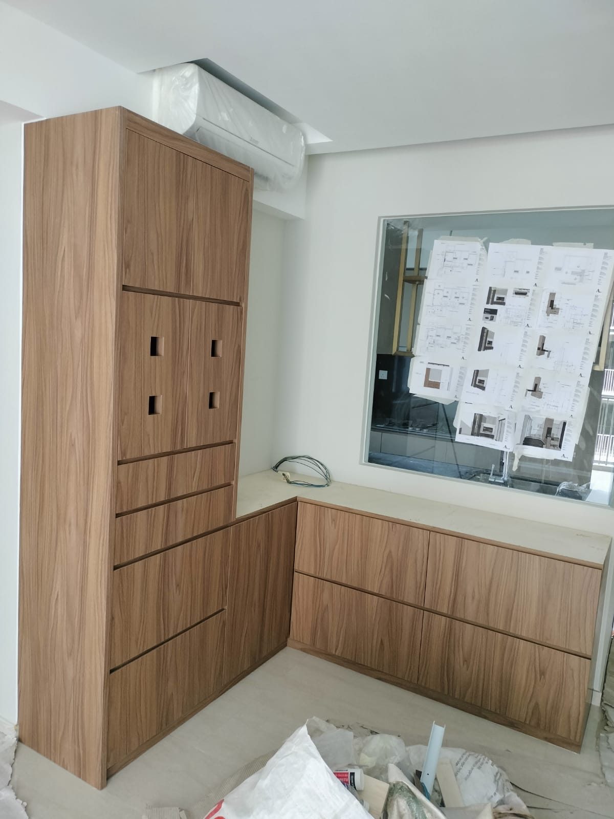 Run of custom light-timber cabinets