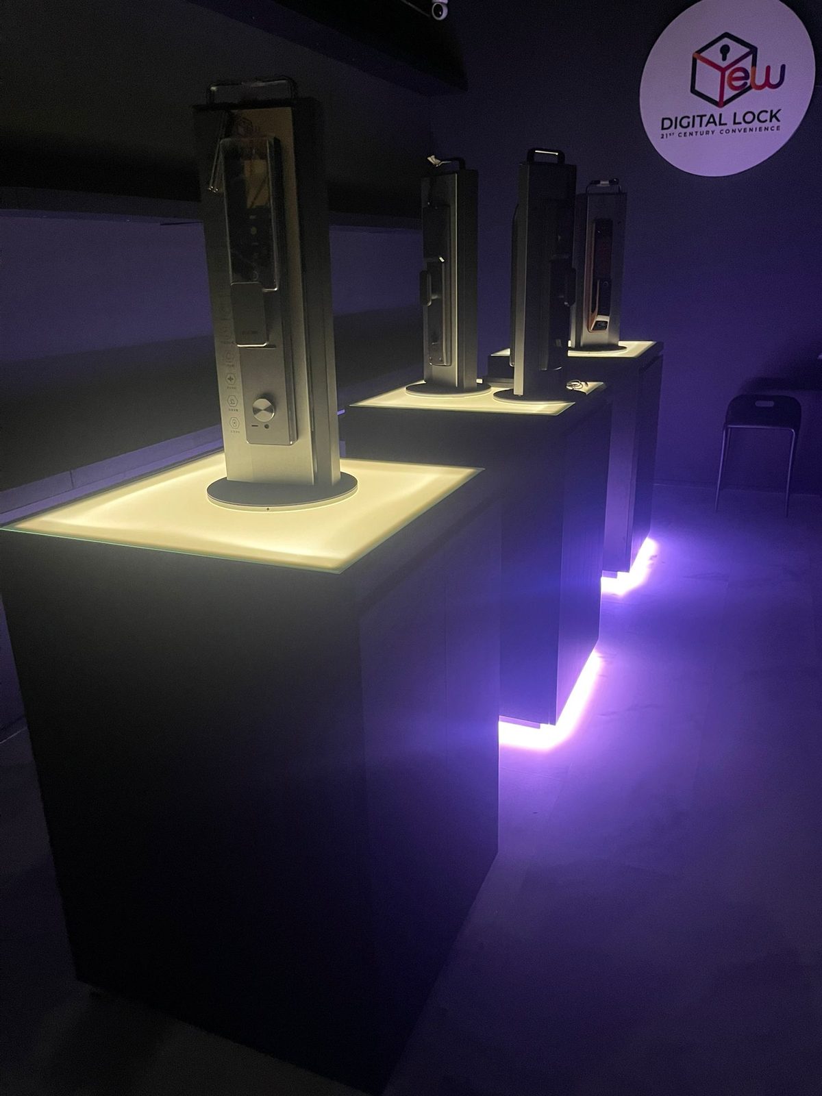 Retail showroom with illuminated pedestals displaying digital locks