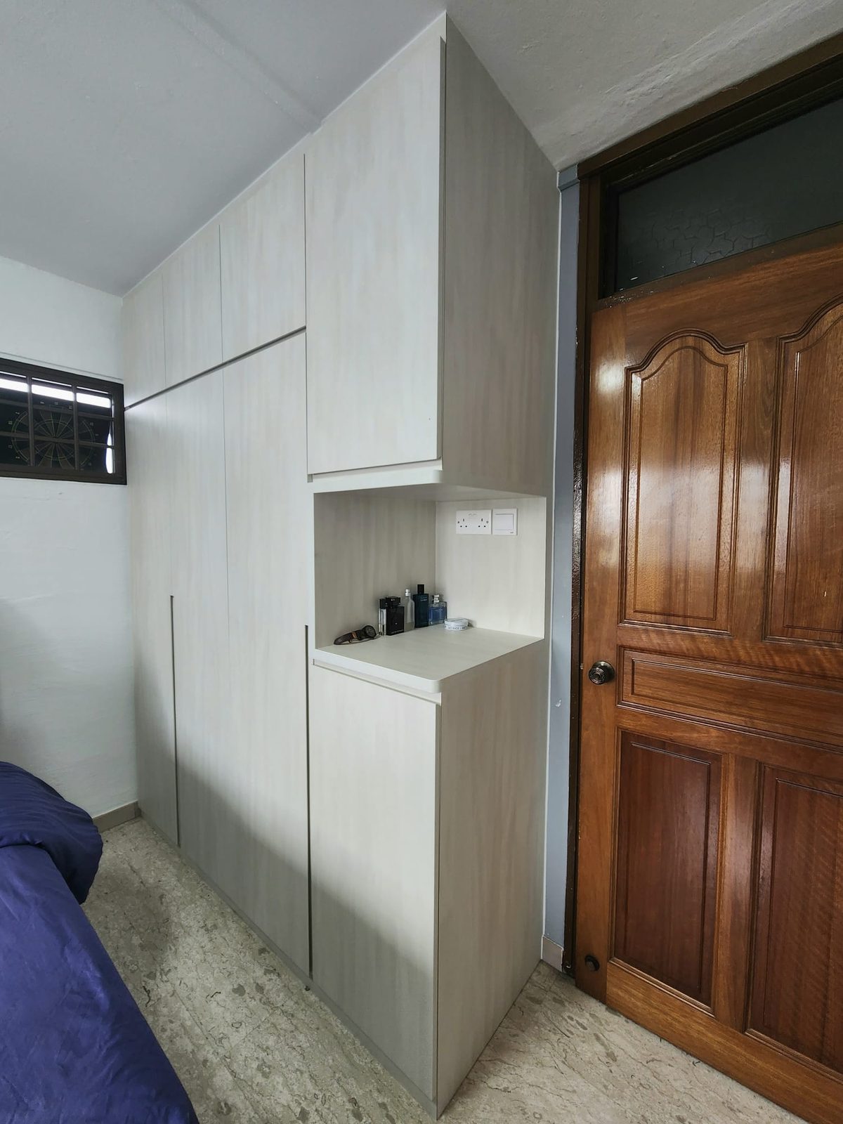 Built-in light-timber wardrobe in a residence